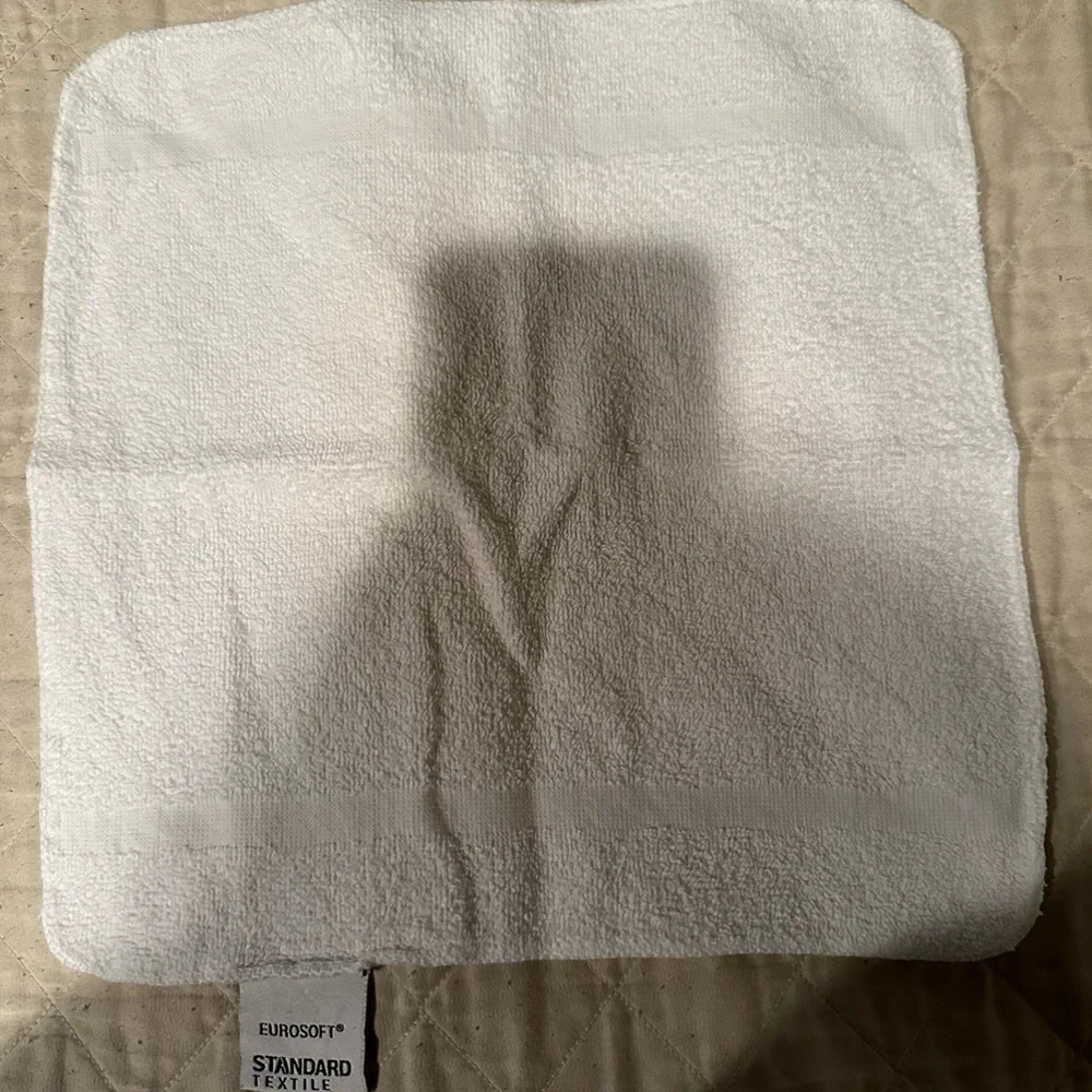 White Eurosoft hand towel - slight discoloration.
